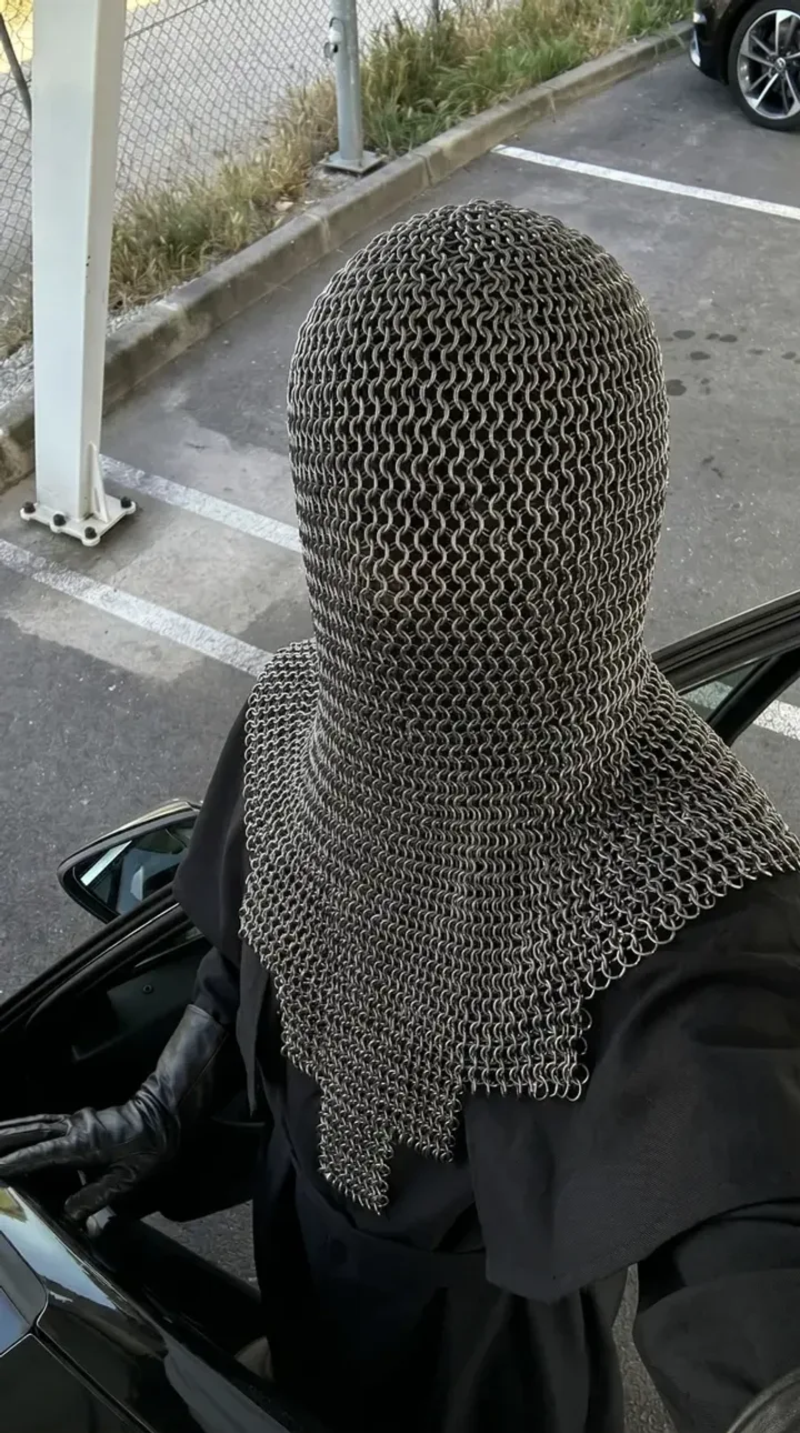 The same scene with a chainmail-hooded figure in place of the original character