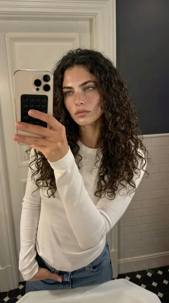 The same synthetic character in a new scene, wardrobe, and light