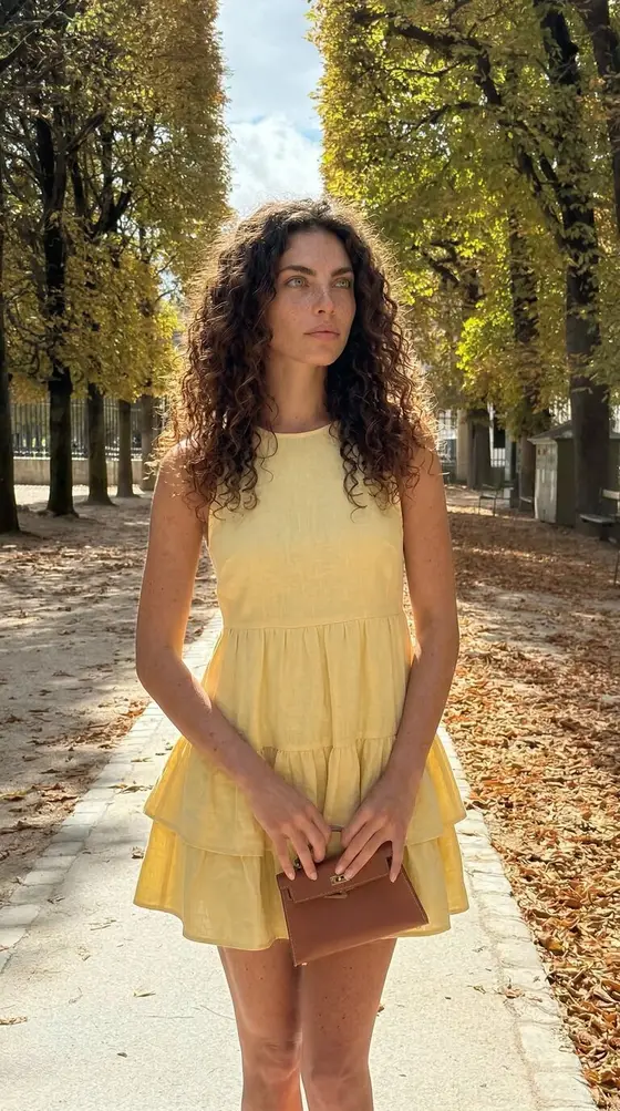 The same synthetic character in a new scene, wardrobe, and light