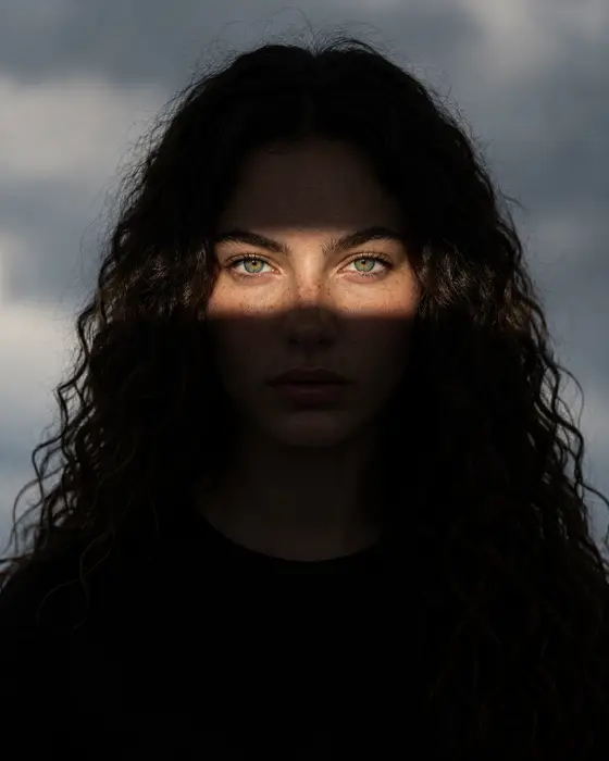 The same character, close portrait against an overcast sky