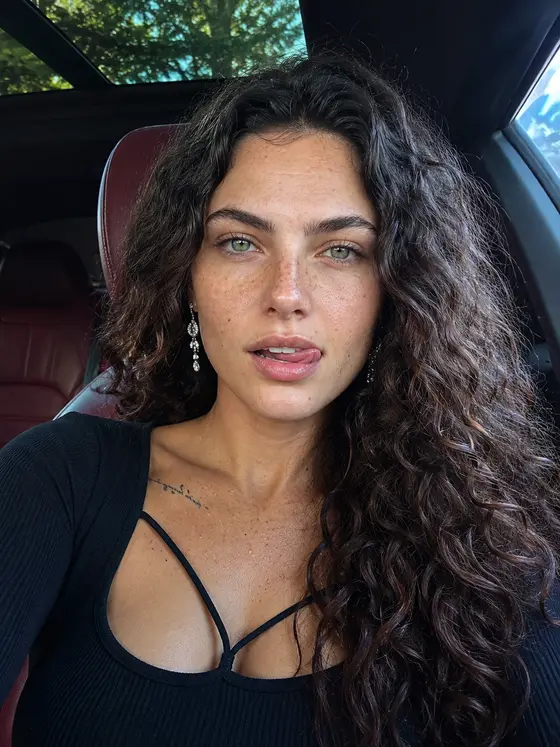 The same character, car interior in afternoon light